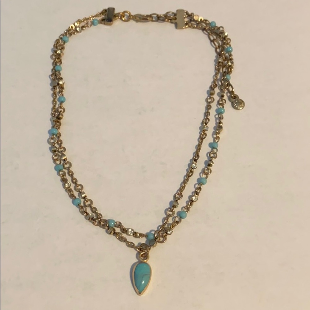 Gold and blue chocker necklace.
